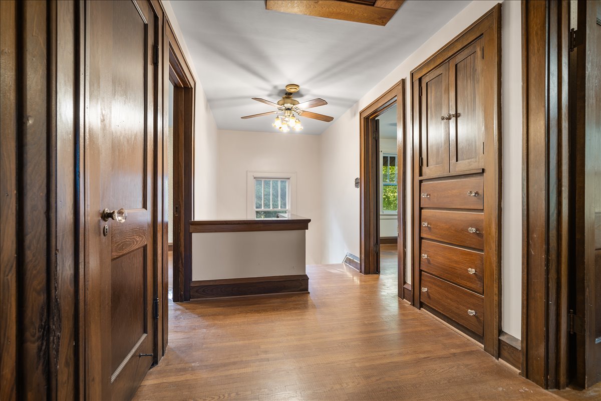 713 Normal Avenue Normal, IL 61761 - Photo 23 of 43 a view of a hallway with wooden floor