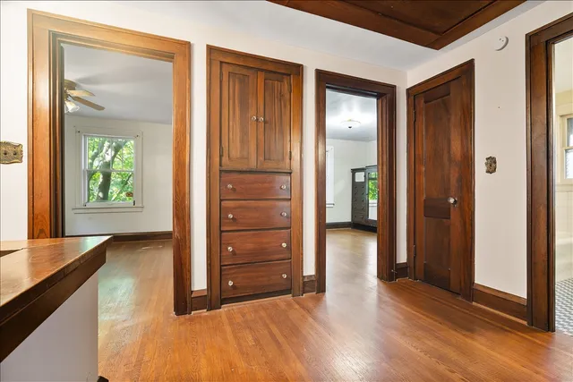 wooden floor in an empty room and a window