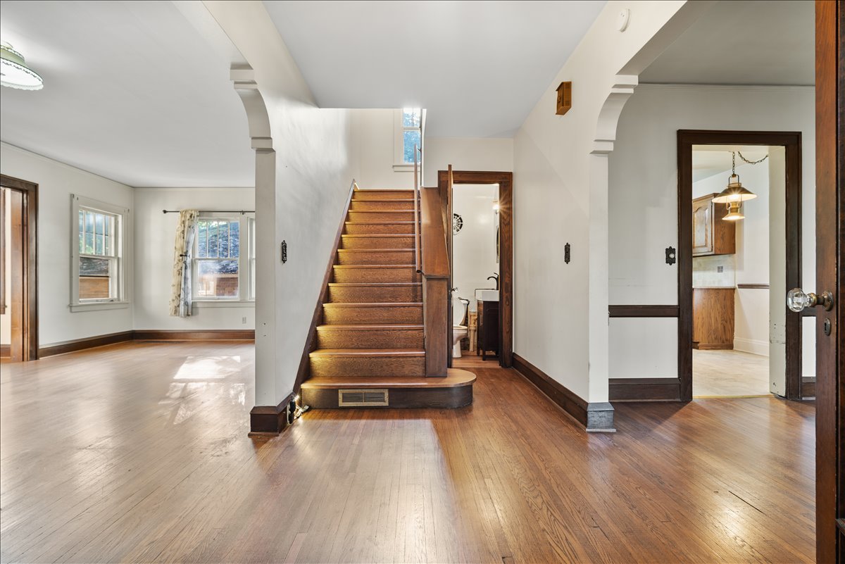 713 Normal Avenue Normal, IL 61761 - Photo 4 of 43 a view of a room with wooden floor and stairs