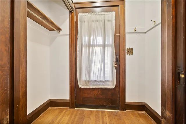 a view of front door with wooden floor