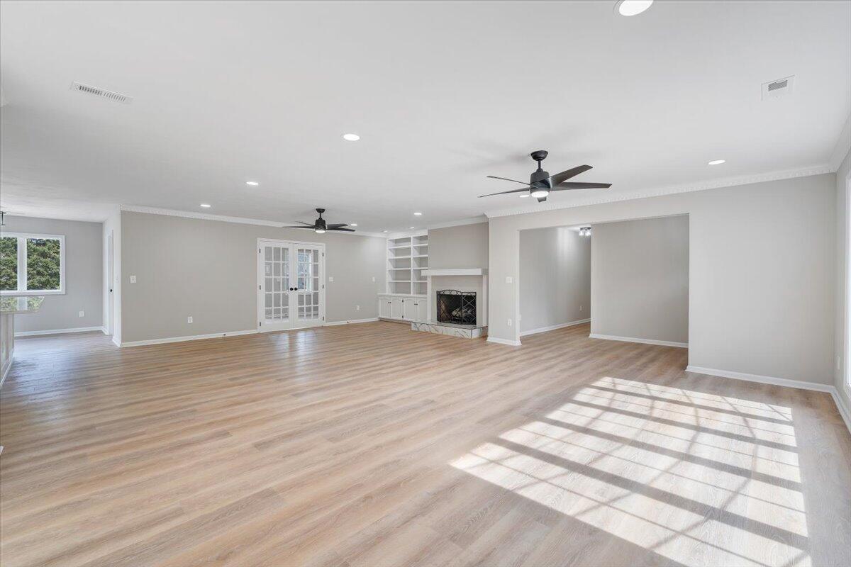 7951 Barrens Road Roanoke, VA 24019 - Photo 14 of 105 a view of an empty room with wooden floor and a window
