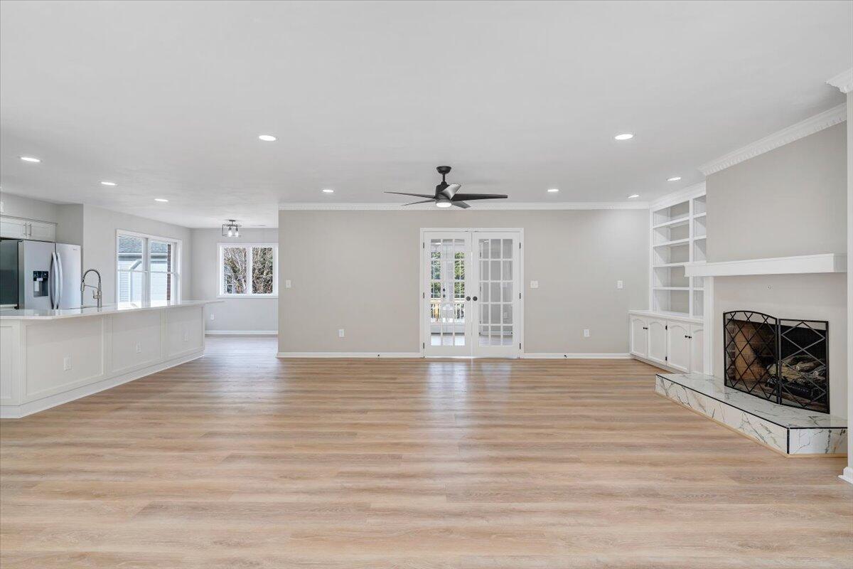 7951 Barrens Road Roanoke, VA 24019 - Photo 15 of 105 a view of an empty room with wooden floor and a fireplace