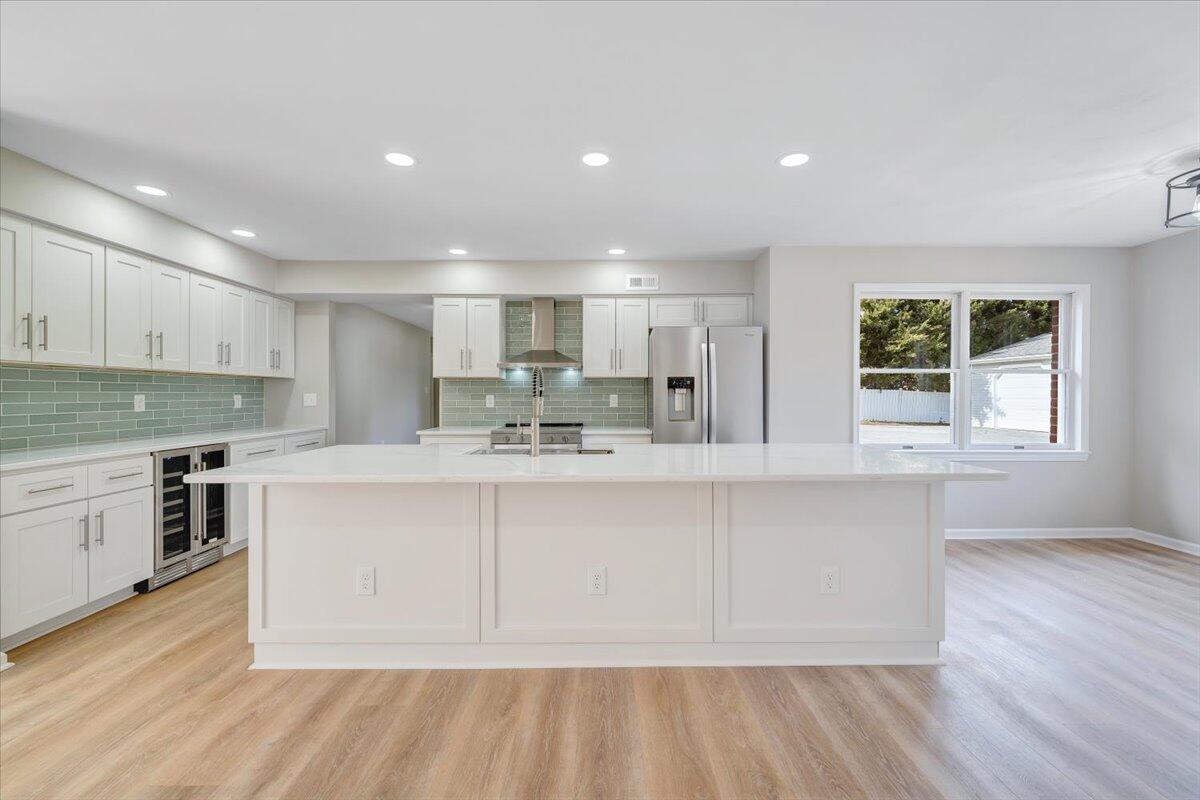 7951 Barrens Road Roanoke, VA 24019 - Photo 18 of 105 a kitchen with stainless steel appliances granite countertop a sink a stove a refrigerator cabinets and a wooden floor