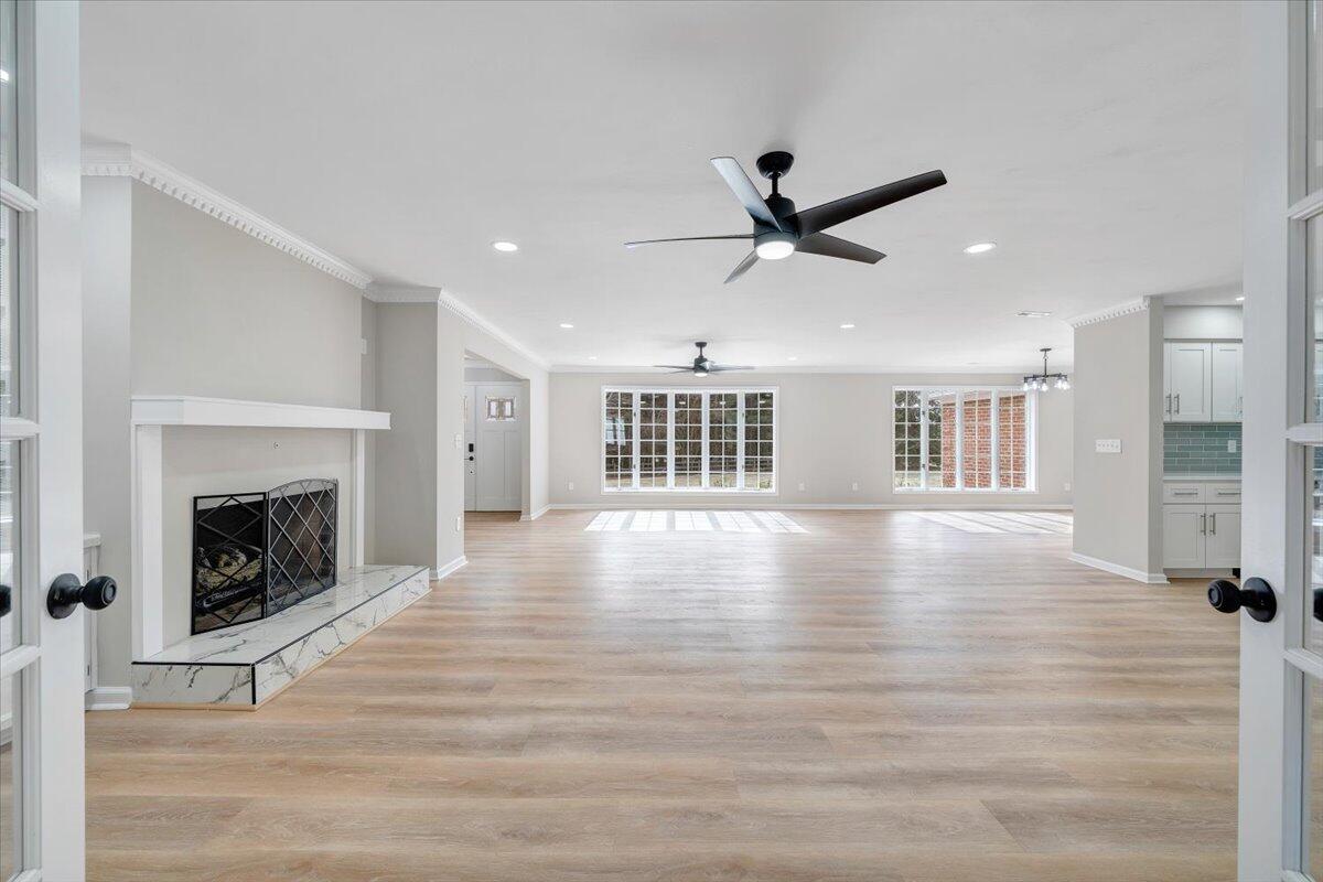 7951 Barrens Road Roanoke, VA 24019 - Photo 36 of 105 a view of an empty room with wooden floor fireplace and a window