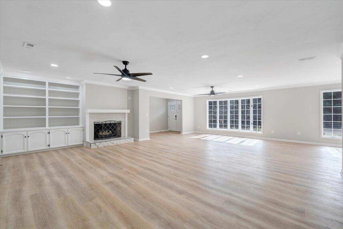 7951 Barrens Road Roanoke, VA 24019 - Photo 37 of 105 an empty room with windows fireplace and windows