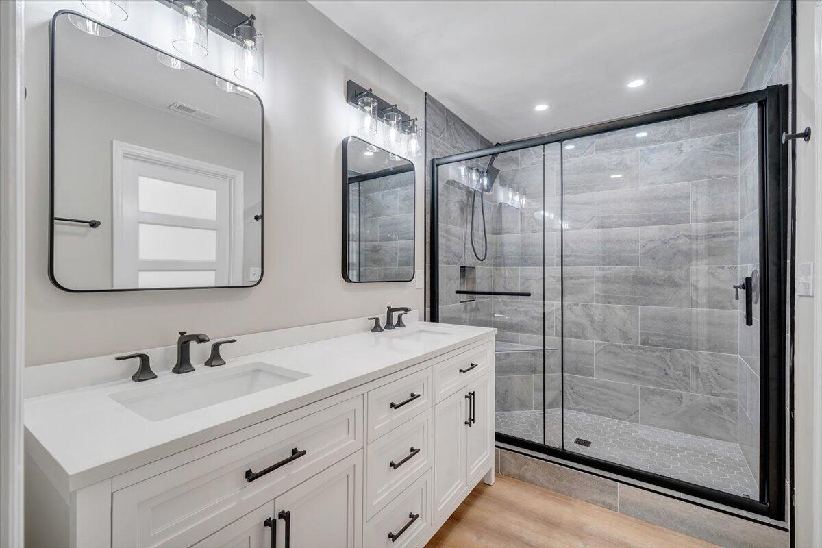 7951 Barrens Road Roanoke, VA 24019 - Photo 41 of 105 a bathroom with a double vanity sink mirror and shower