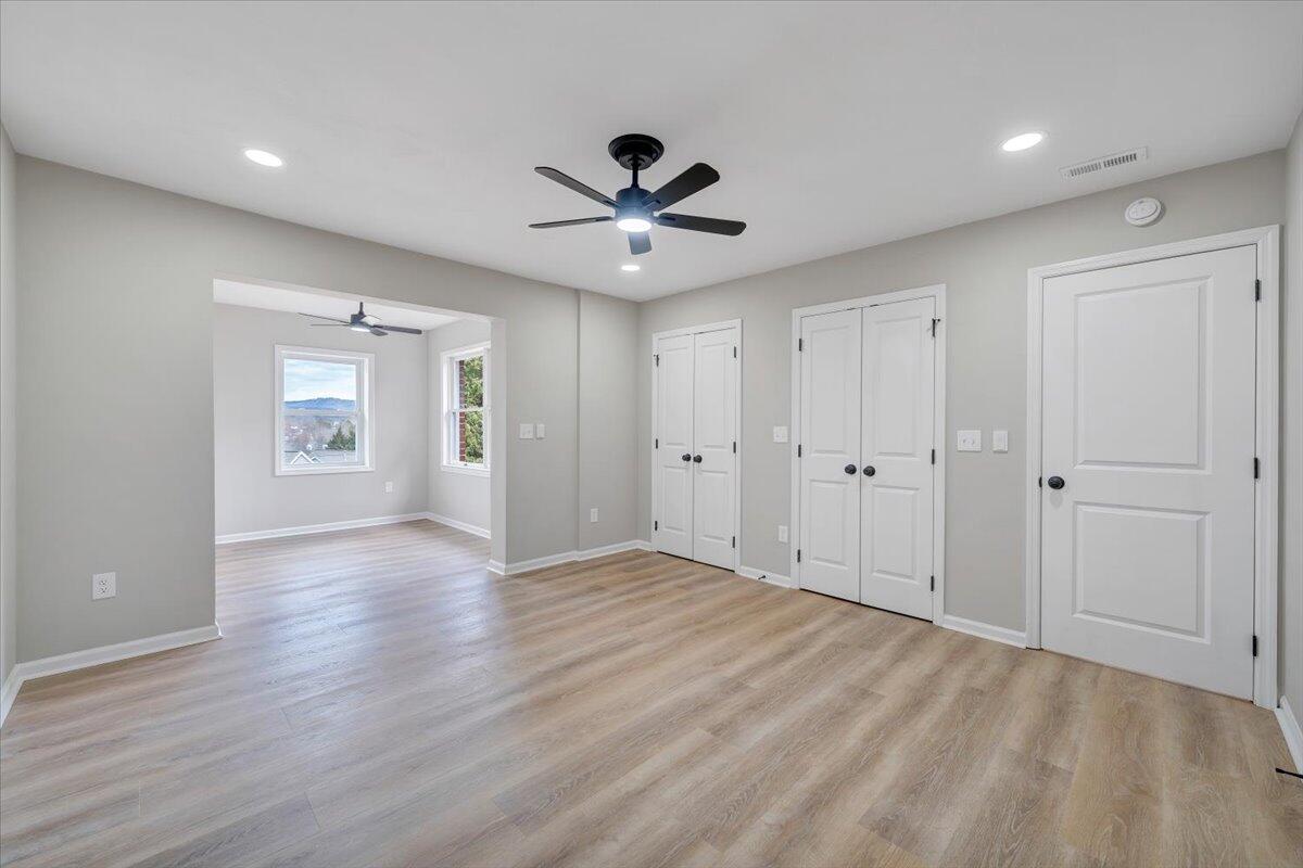 7951 Barrens Road Roanoke, VA 24019 - Photo 48 of 105 a view of an empty room with a ceiling fan window and closet