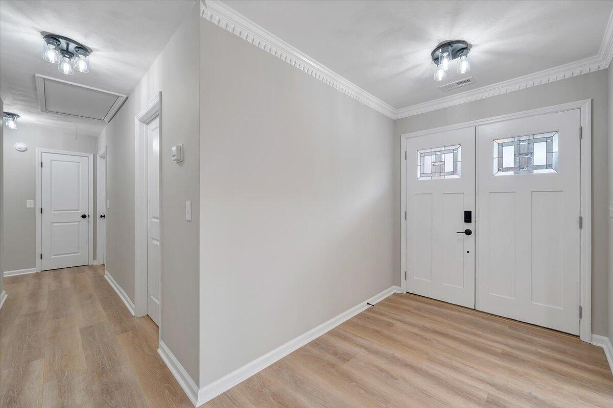 7951 Barrens Road Roanoke, VA 24019 - Photo 8 of 105 a view of an empty room with window and wooden floor