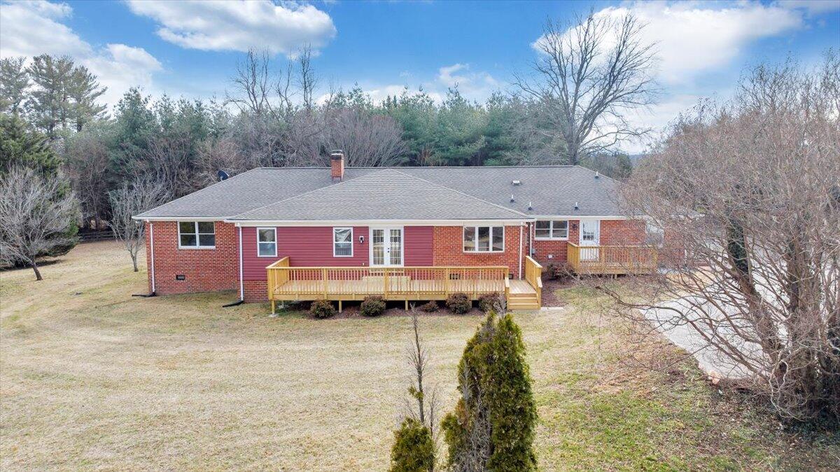 7951 Barrens Road Roanoke, VA 24019 - Photo 88 of 105 a aerial view of a house with a yard covered in snow