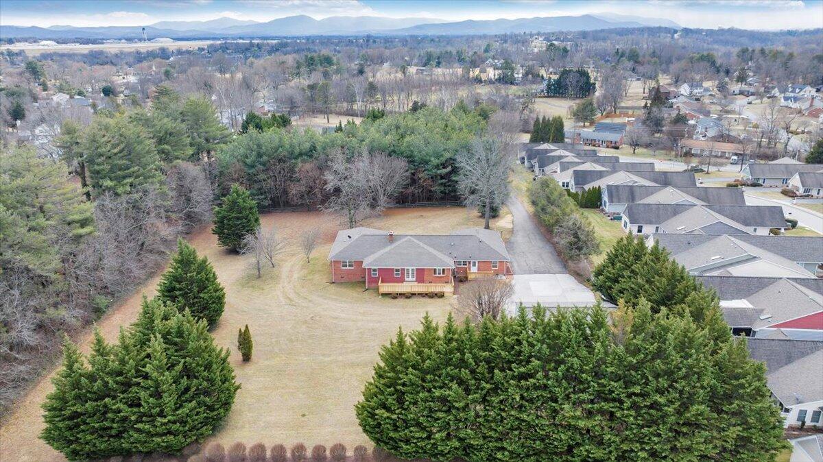 7951 Barrens Road Roanoke, VA 24019 - Photo 90 of 105 an aerial view of a house with a garden and mountain view