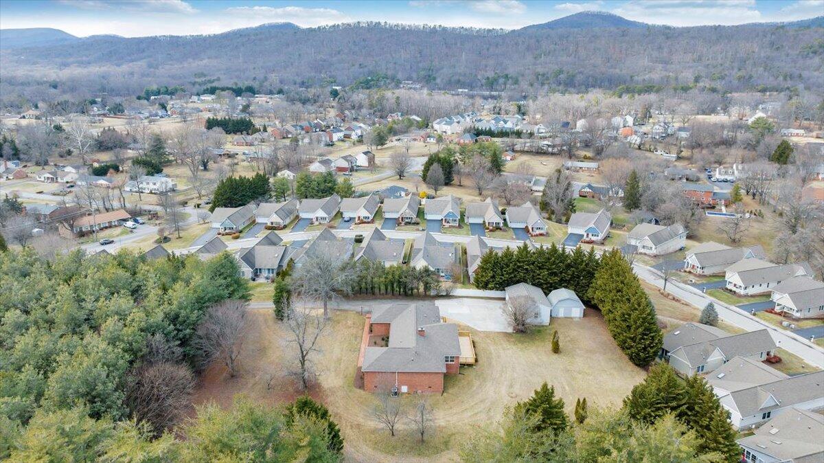 7951 Barrens Road Roanoke, VA 24019 - Photo 92 of 105 an aerial view of a city with lots of residential buildings ocean and mountain view
