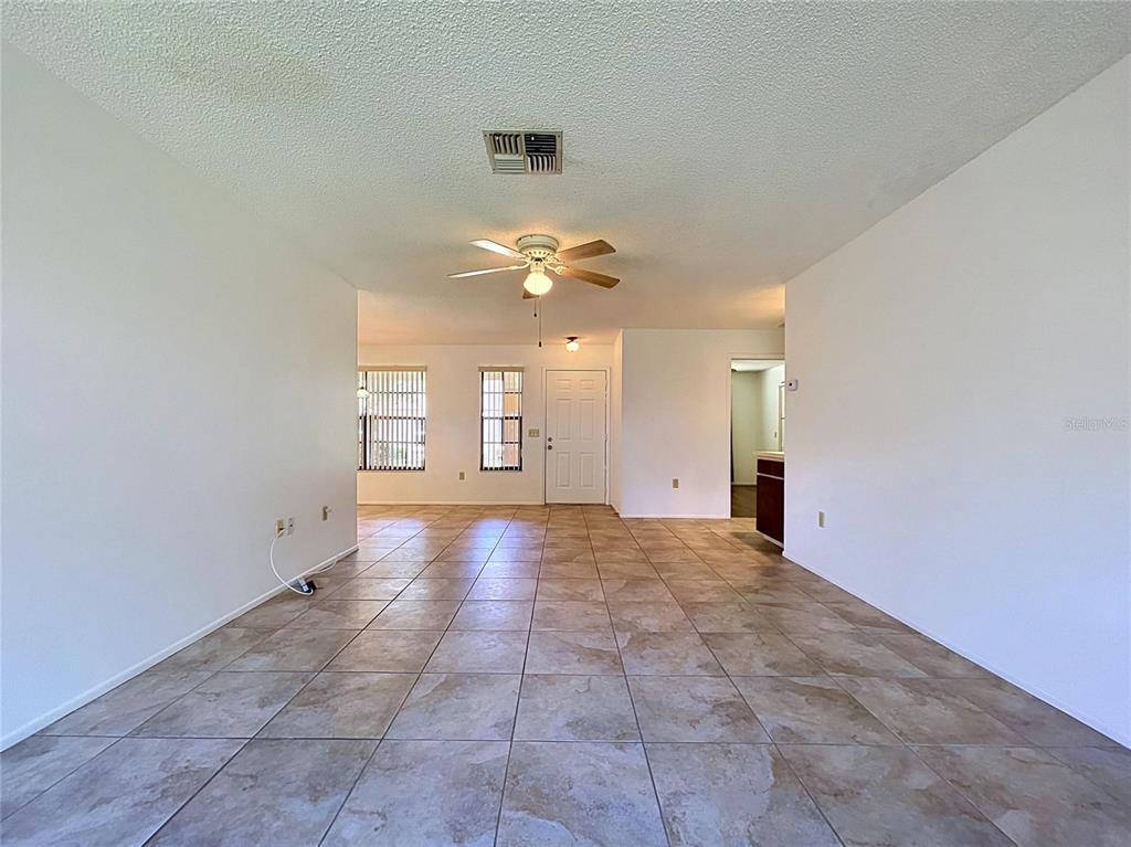 9319 Trowbridge Court New Port Richey, FL 34655 - Photo 20 of 78 a view of an empty room with a window