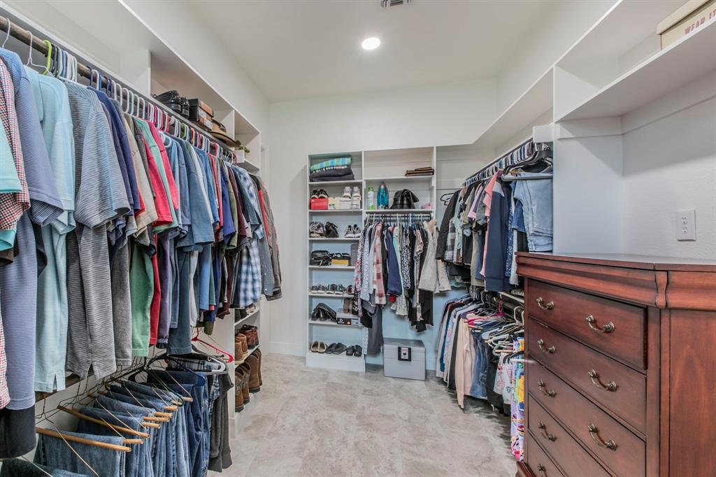 790 Bones Chapel Road Whitesboro, TX 76273 - Photo 17 of 36 a view of walk in closet with clothes