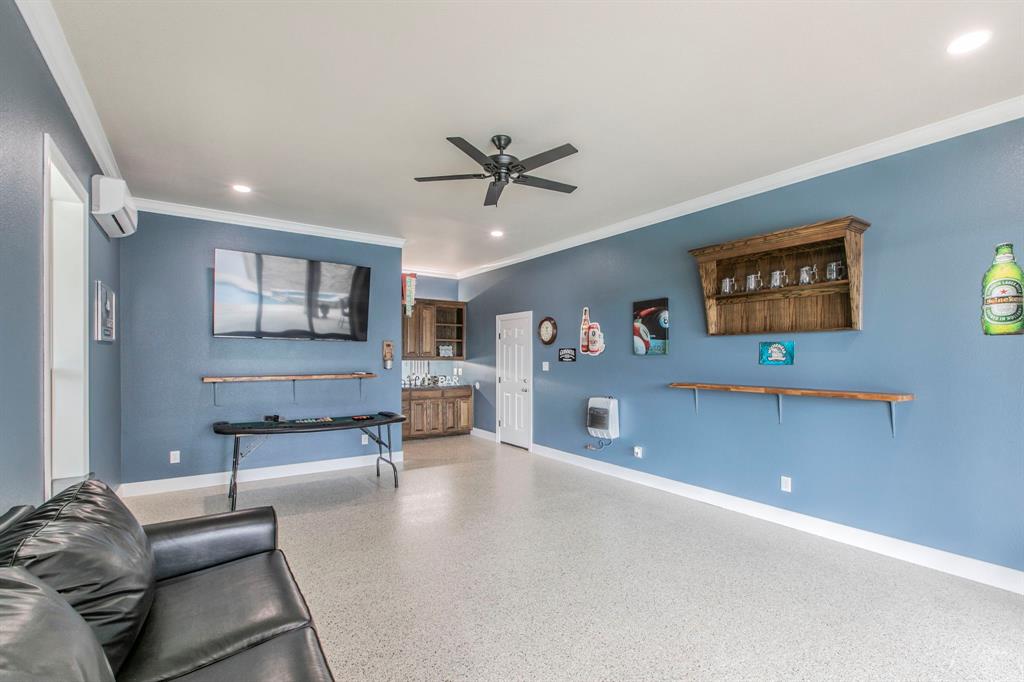 790 Bones Chapel Road Whitesboro, TX 76273 - Photo 25 of 36 a living room with furniture and a flat screen tv