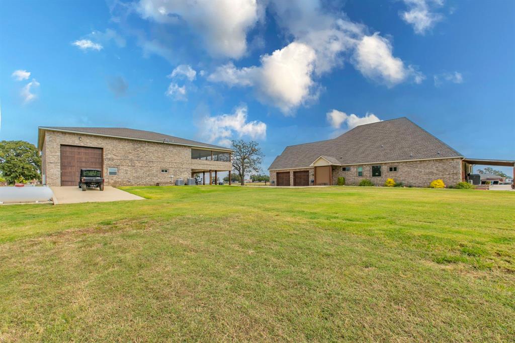 790 Bones Chapel Road Whitesboro, TX 76273 - Photo 31 of 36 a front view of house with yard and car parked
