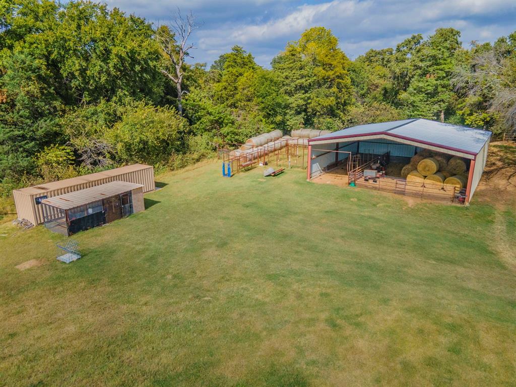 790 Bones Chapel Road Whitesboro, TX 76273 - Photo 35 of 36 a backyard of a house with yard and outdoor seating
