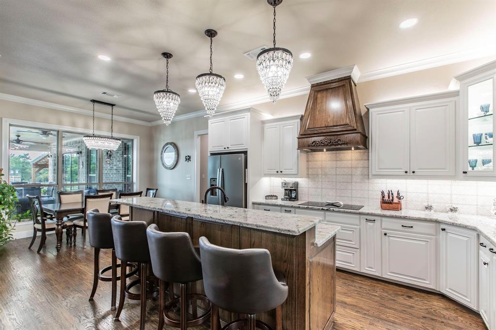 790 Bones Chapel Road Whitesboro, TX 76273 - Photo 6 of 36 a large kitchen with a table and chairs