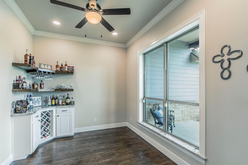 790 Bones Chapel Road Whitesboro, TX 76273 - Photo 9 of 36 a view of a kitchen with fridge and wooden floor