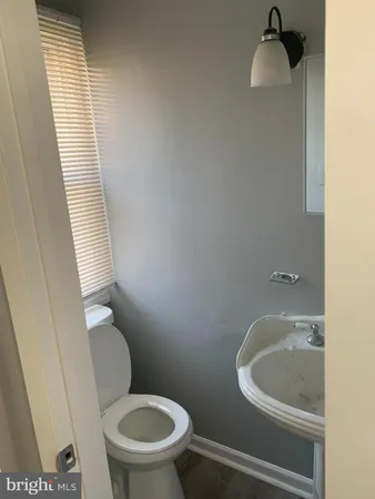 a bathroom with a toilet and a sink