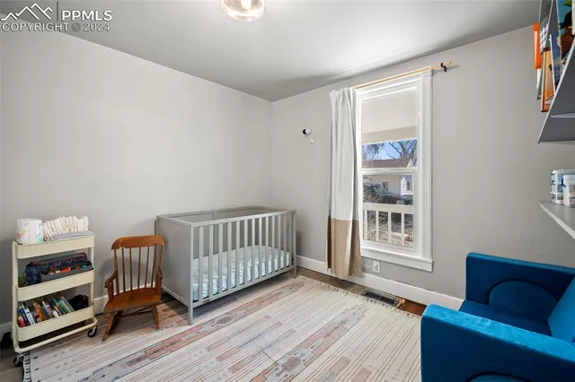 a bedroom with furniture and a window