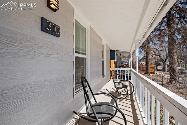 a view of a balcony with chairs