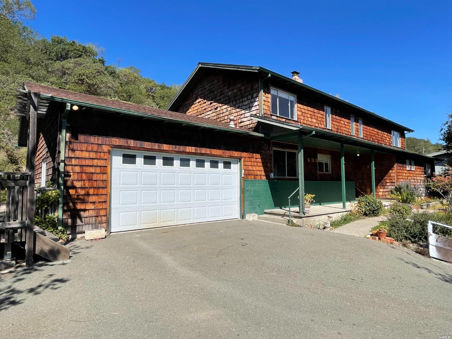 outdoor view of house with outdoor space and porch