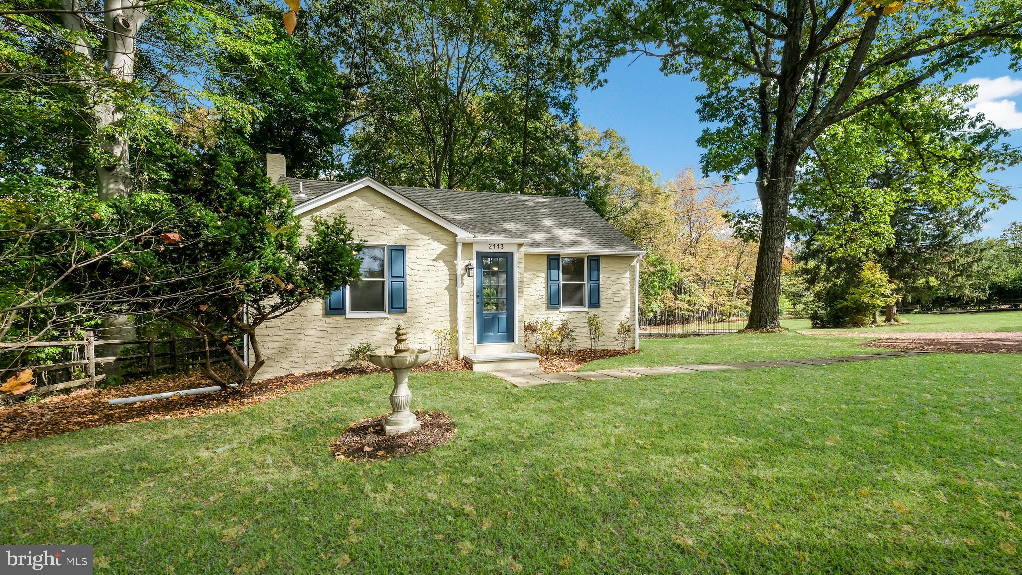 2443 Sugar Bottom Road Furlong, PA 18925 - Photo 1 of 39 a front view of a house with a yard and trees