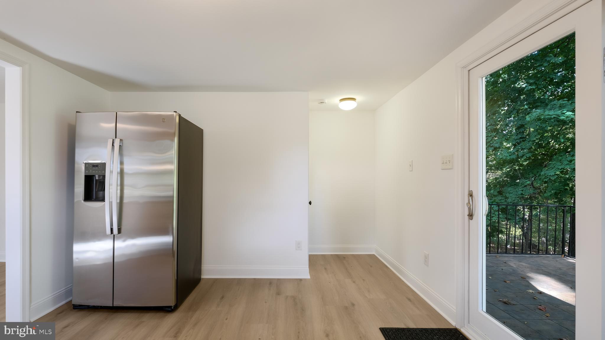 2443 Sugar Bottom Road Furlong, PA 18925 - Photo 11 of 39 a view of a refrigerator in kitchen and wooden floor