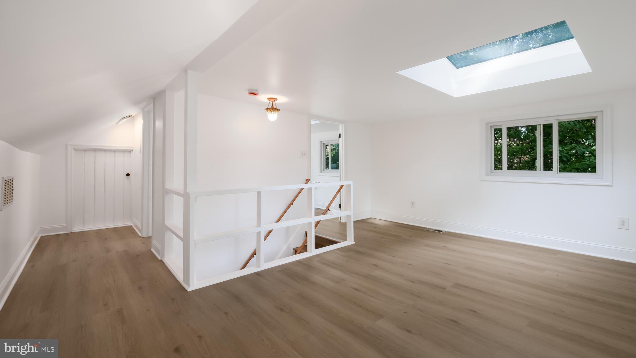 2443 Sugar Bottom Road Furlong, PA 18925 - Photo 19 of 39 wooden floor in an empty room with a window