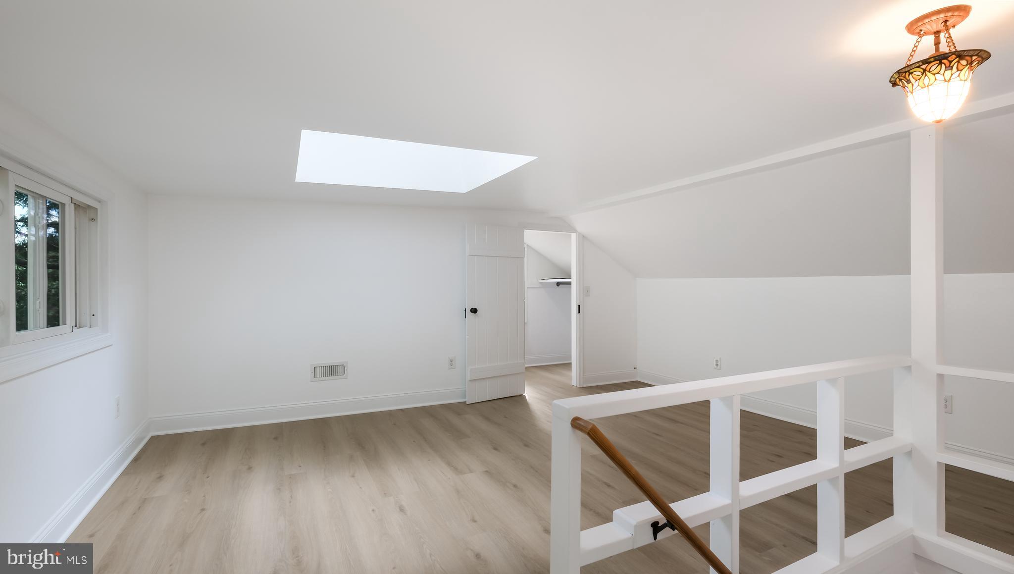 2443 Sugar Bottom Road Furlong, PA 18925 - Photo 20 of 39 a view of an empty room with wooden floor and a window