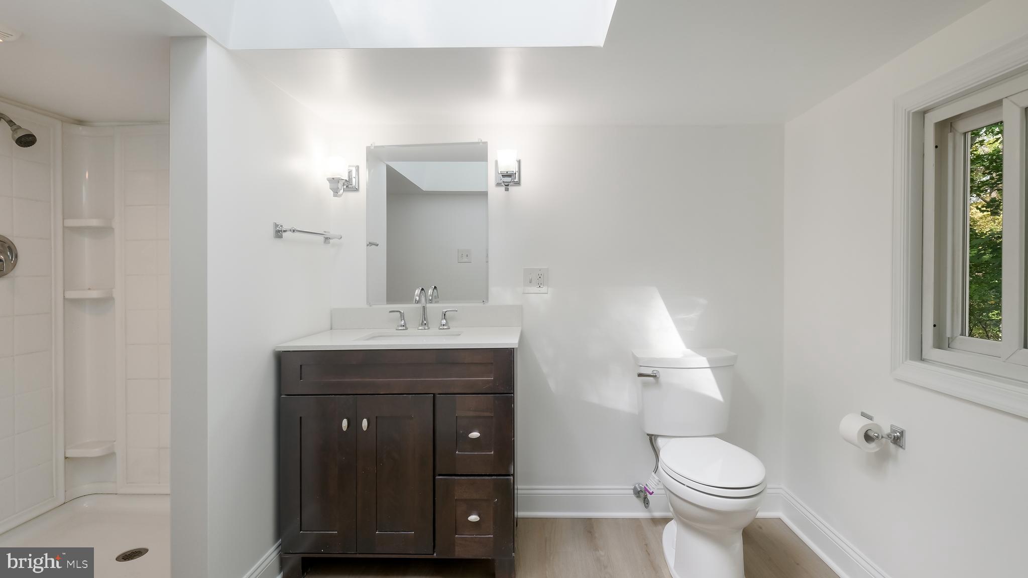 2443 Sugar Bottom Road Furlong, PA 18925 - Photo 22 of 39 a bathroom with a toilet a sink and mirror