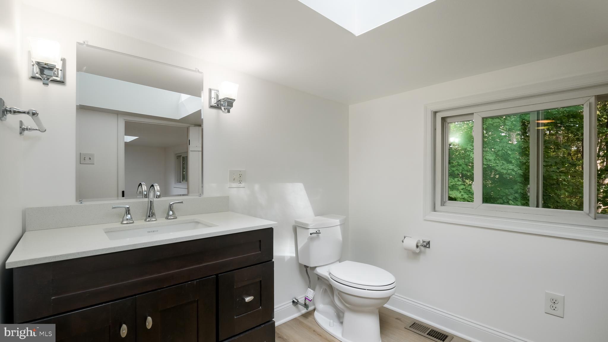 2443 Sugar Bottom Road Furlong, PA 18925 - Photo 24 of 39 a bathroom with a sink vanity mirror and toilet