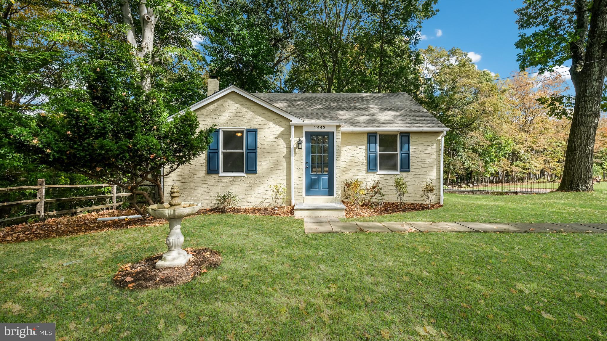 2443 Sugar Bottom Road Furlong, PA 18925 - Photo 3 of 39 a front view of a house with a yard