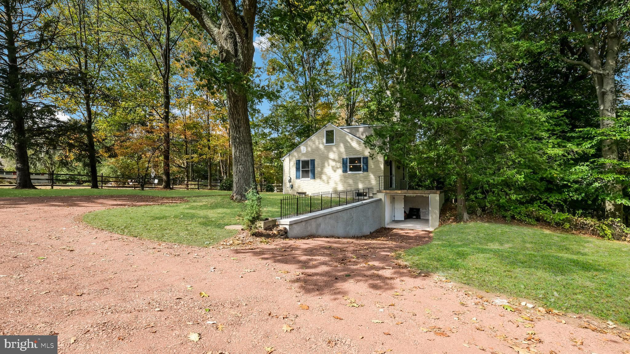 2443 Sugar Bottom Road Furlong, PA 18925 - Photo 32 of 39 a front view of a house with a yard
