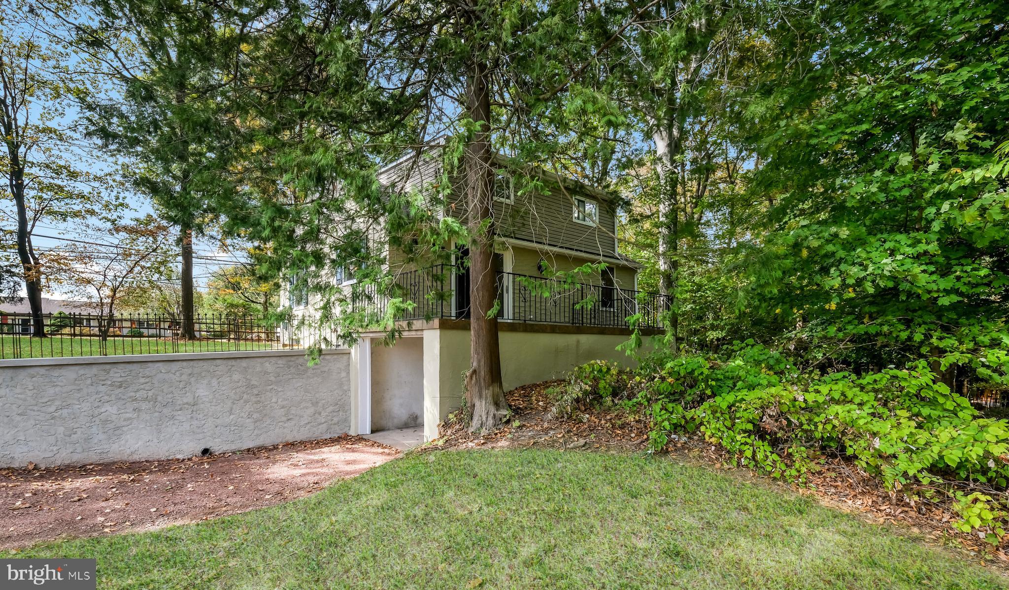 2443 Sugar Bottom Road Furlong, PA 18925 - Photo 33 of 39 front view of a house with a tree