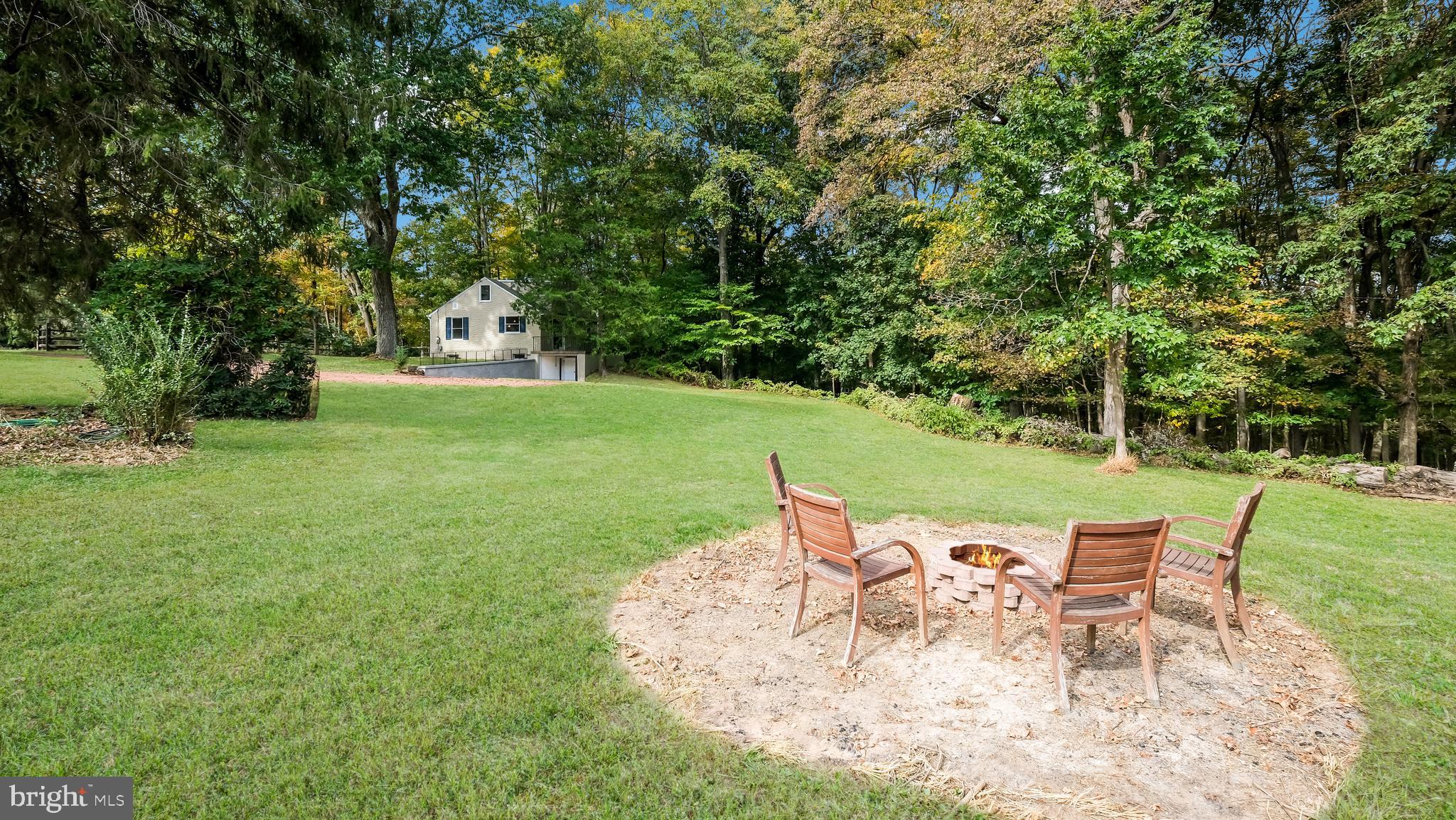 2443 Sugar Bottom Road Furlong, PA 18925 - Photo 35 of 39 a view of a table and chairs in backyard of the house