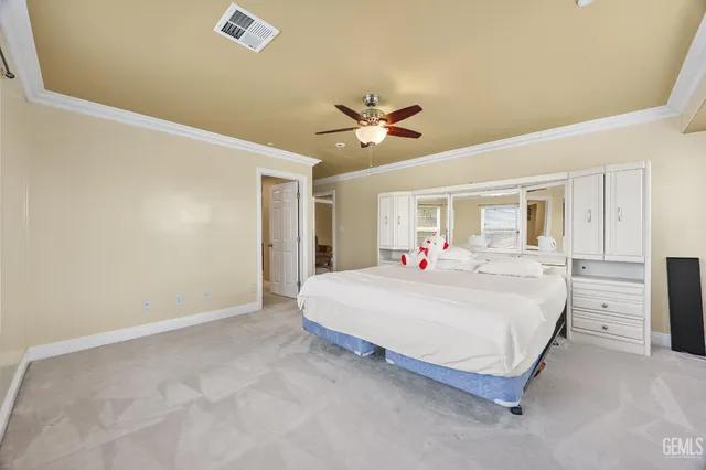 a bed room with a bed and a chandelier