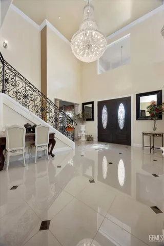 a view of living room with furniture and a chandelier