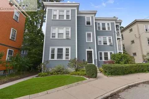 a front view of a house with garden