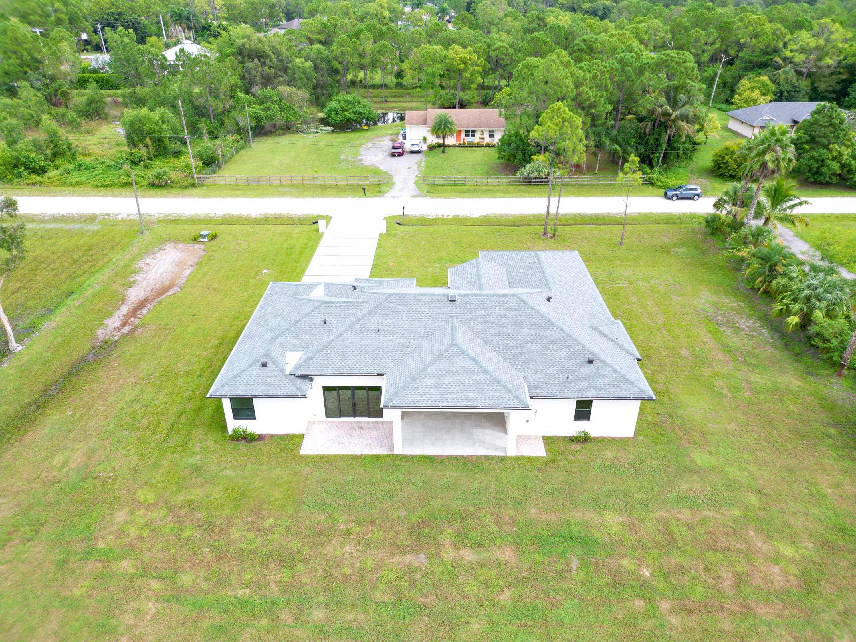17436 71st Lane North Loxahatchee, FL 33470 - Photo 7 of 50 a aerial view of a house with swimming pool
