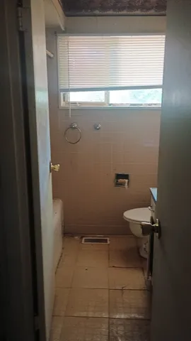 a bathroom with a toilet
