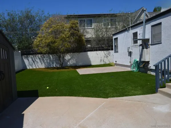 a backyard of a house with lots of green space