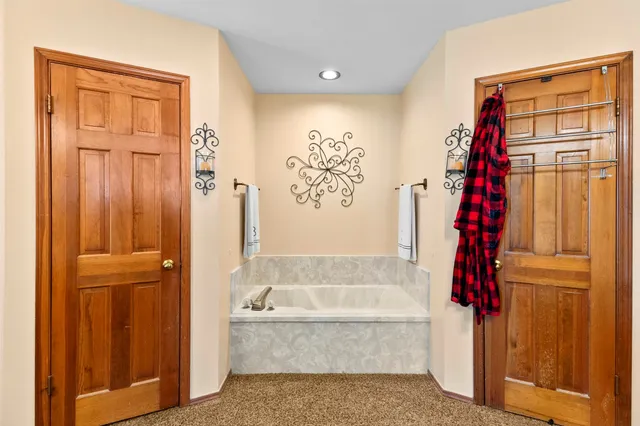 a bedroom with furniture and a window