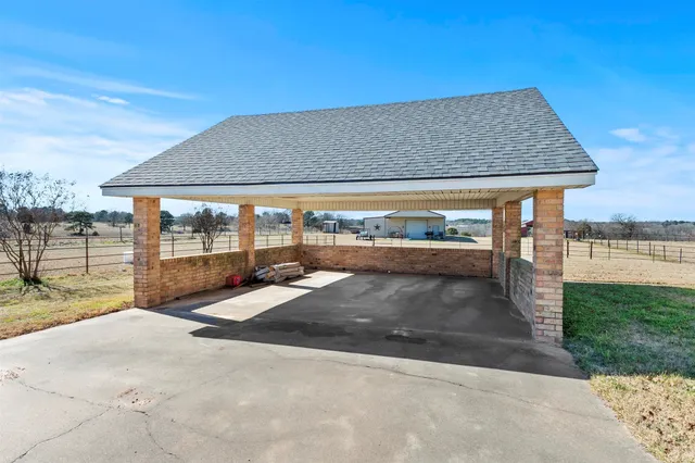 a view of a swimming pool with chair and table
