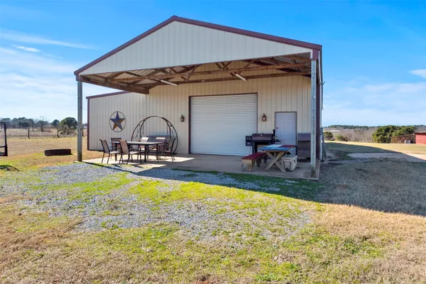 a room with gym equipment and lots of equipment