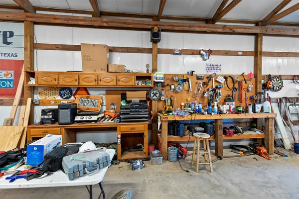 a view of a garage with a lot of stuff