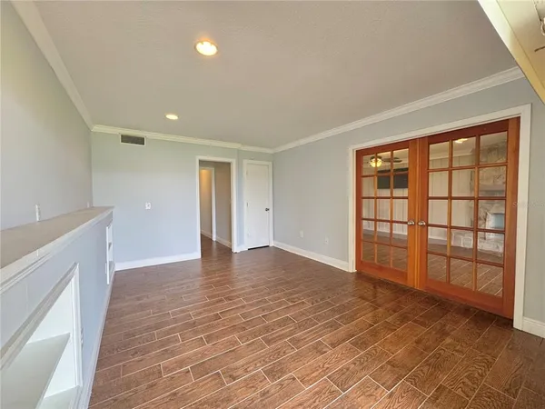 a view of a living room and floor to ceiling window