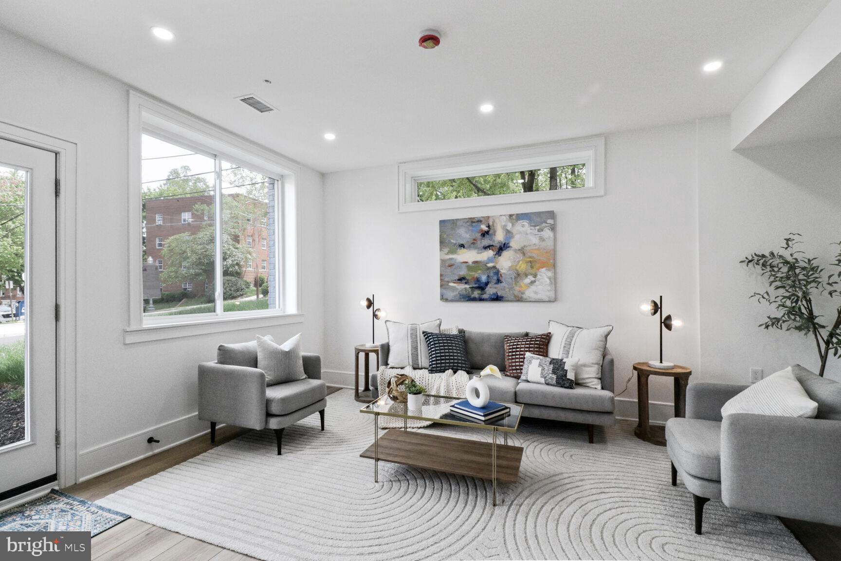 2524 41st Street Northwest, Unit 1 Washington, DC 20007 - Photo 1 of 27 a living room with furniture and a large window