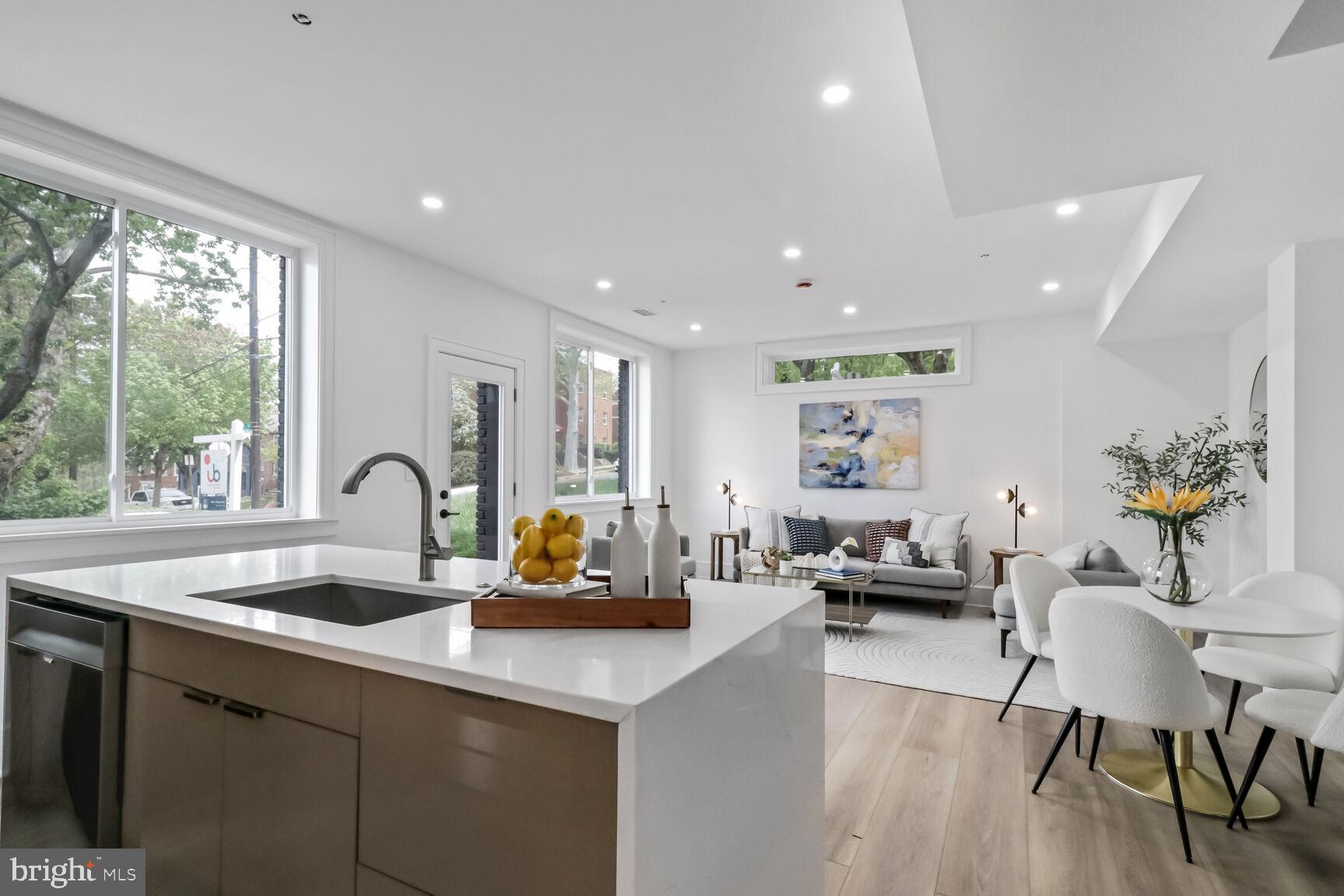 2524 41st Street Northwest, Unit 1 Washington, DC 20007 - Photo 11 of 27 a kitchen with sink a table and chairs