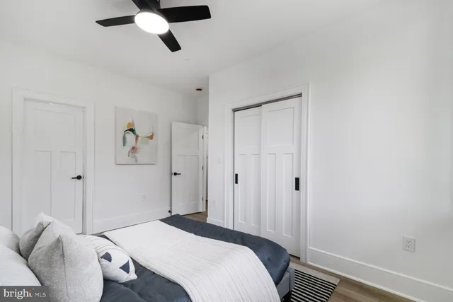 a bedroom with bed and a window